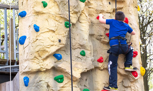 Picture of a child using the climbing wall at Sky Reach